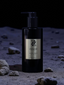 Zenzar bottle on a moon-like surface with rocks