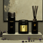 Zenzar lavender calm diffuser and candles on a stone surface with a neutral background